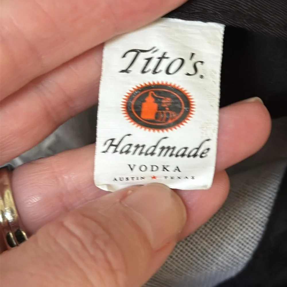 Tito’s Handmade Vodka black orange embroidered Texas adjustable baseball hat